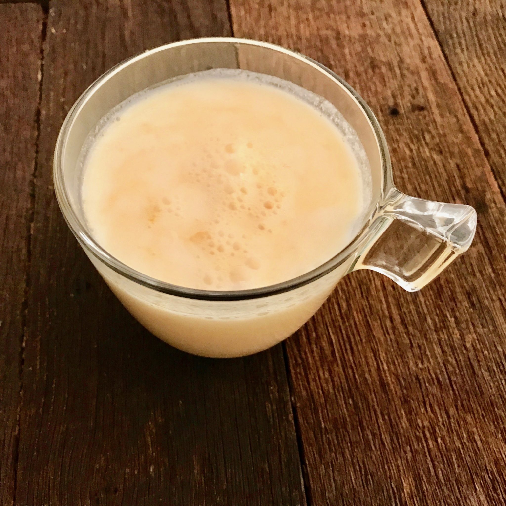 a glass of homemade kefir with orange juice