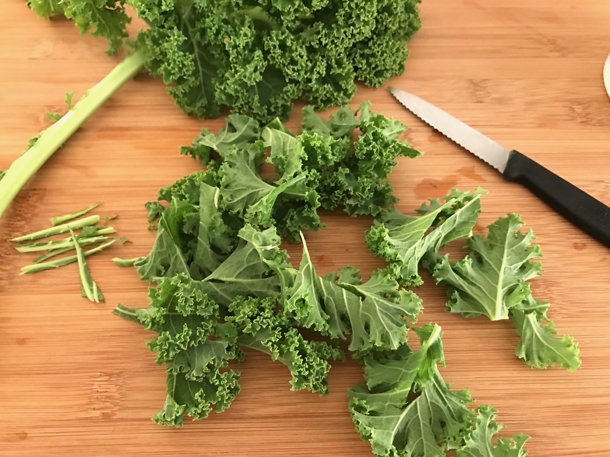 cut kale into bite-size pieces and remove the stems