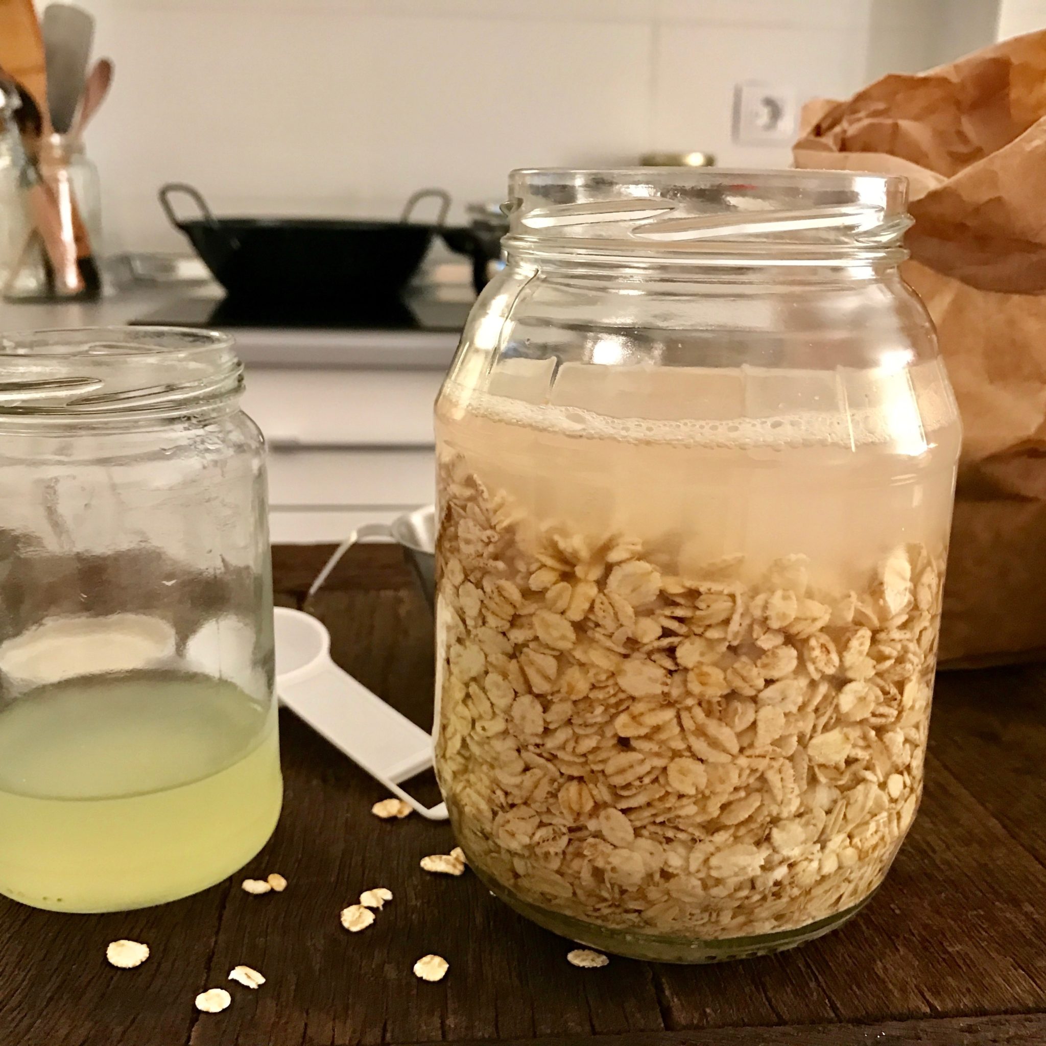 Mix rolled oats and barley flakes in a glass jar, cover them with lukewarm water, add 1 tbsp of liquid whey