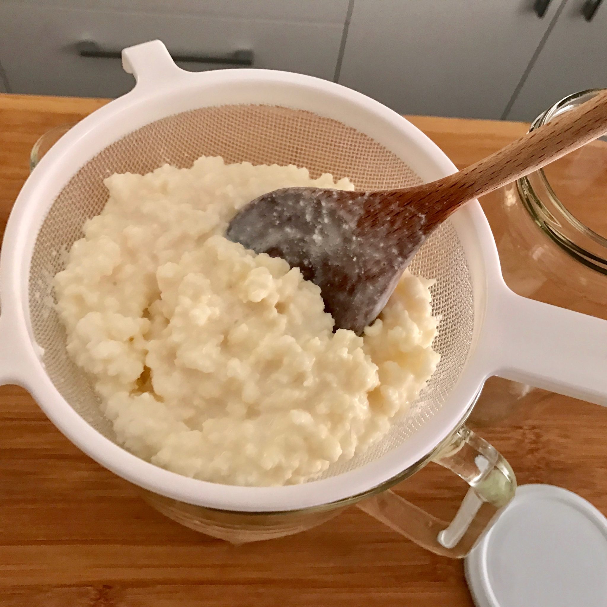 strain the grains in a plastic strainer with a wooden spoon