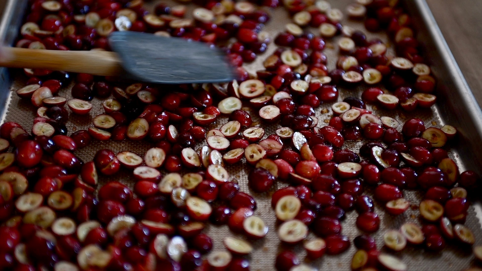 spreading cranberries on a sheet pan