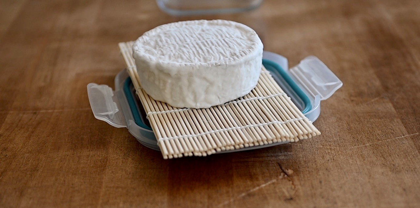 let the cheese age on a bamboo mat