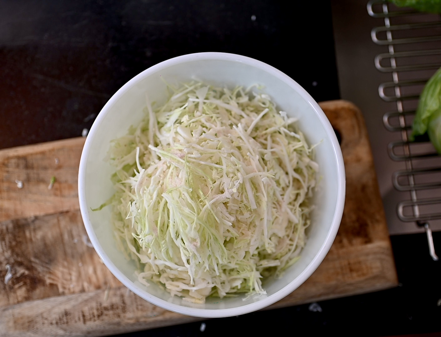 shredded green cabbage with salt