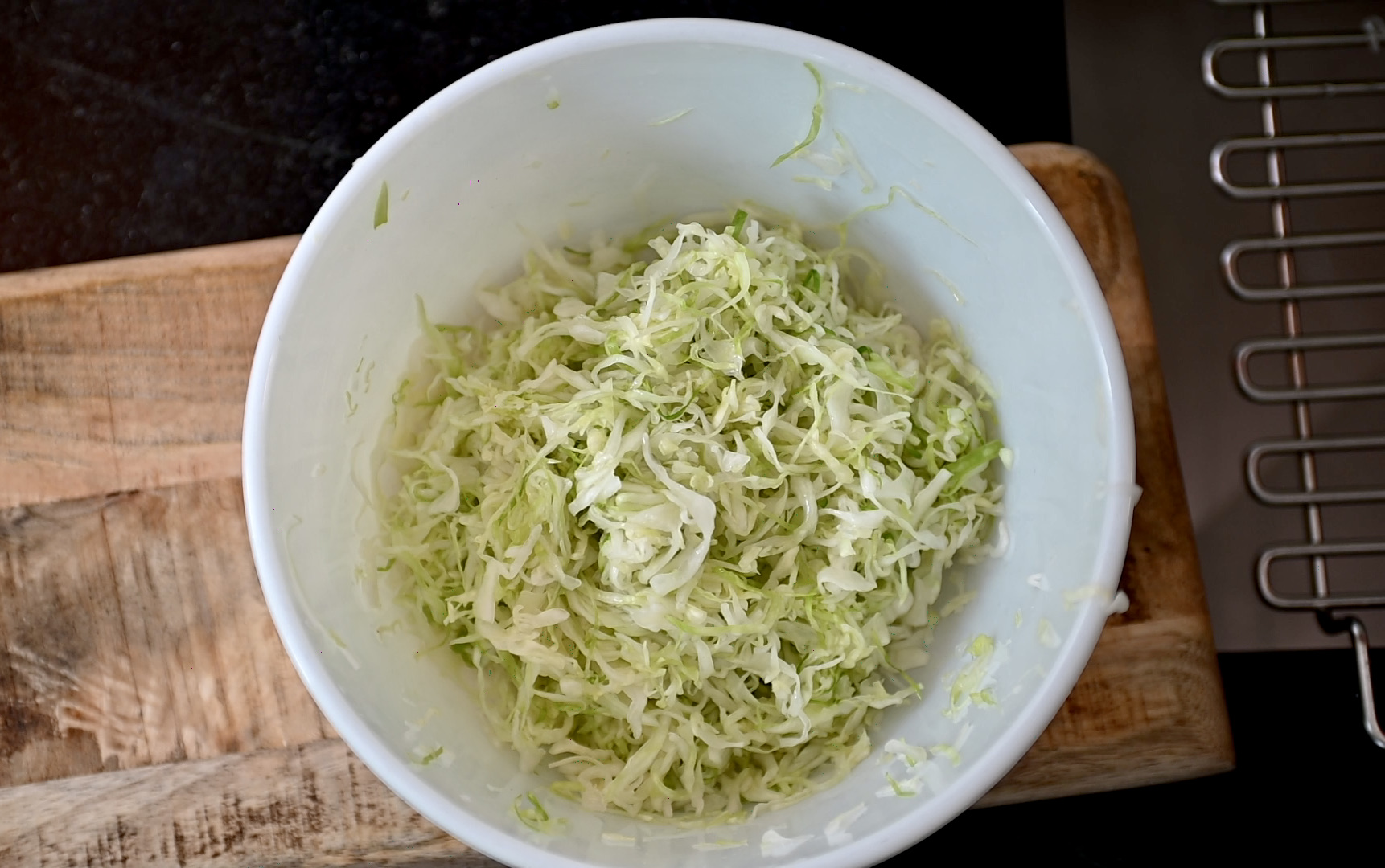 shredded green cabbage in salt brine