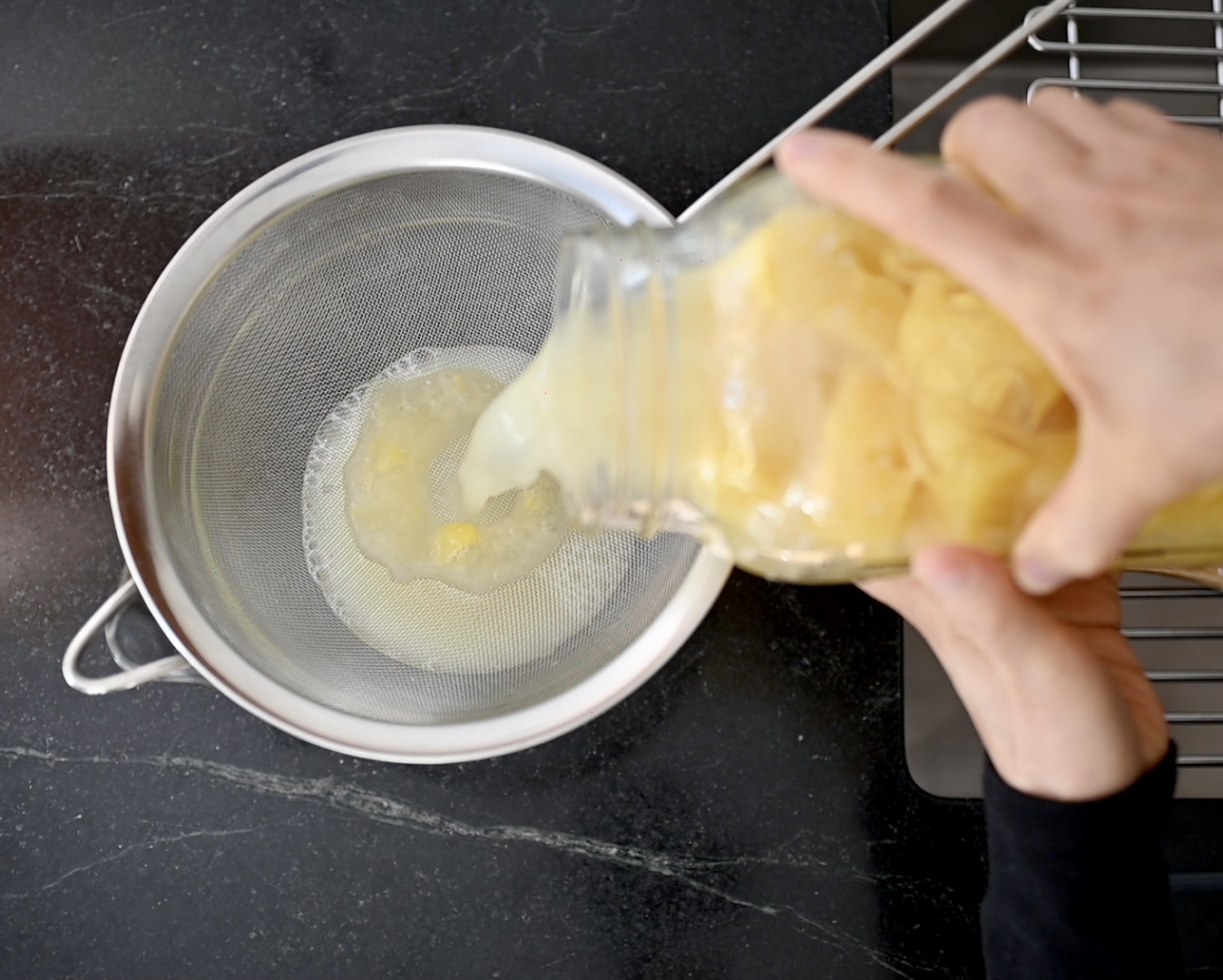 straining the pineapple vinegar
