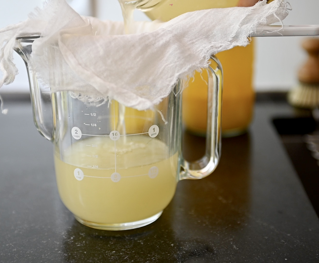 filtering pineapple vinegar